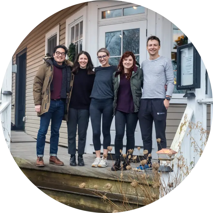 5 people standing on porch