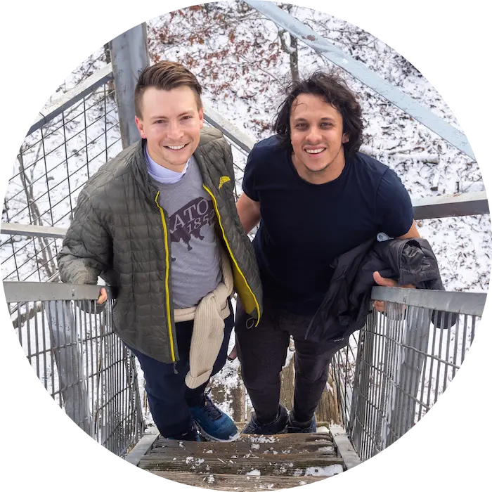 2 people standing on stairs